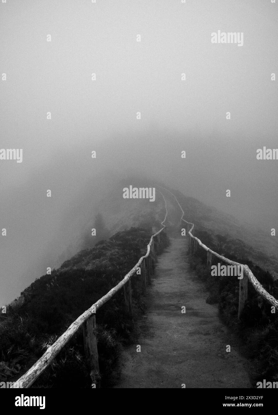 Trail to Boca do Inferno Viewpoint disappears into the mist and clouds Stock Photo
