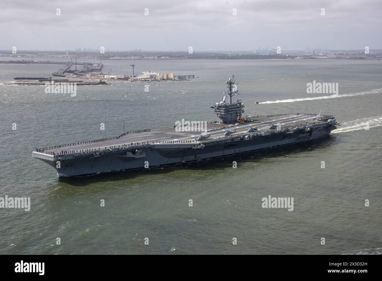 NORFOLK, Va. (April 25, 2024) The Nimitz-class aircraft carrier USS George Washington (CVN 73) departs Naval Station Norfolk, April 25, 2024, for a de Stock Photo