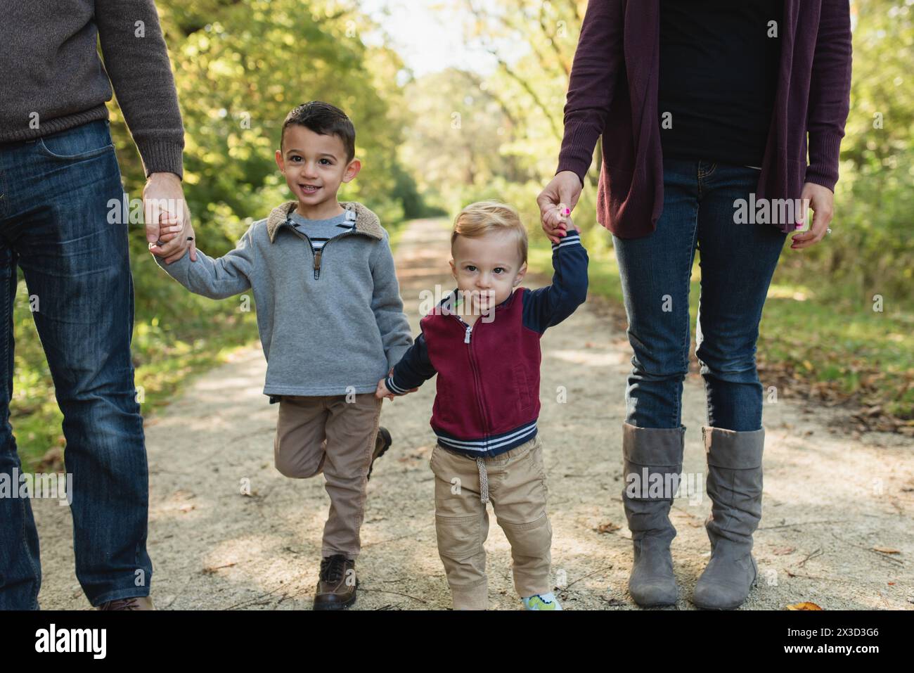 Two young boys holding hands hi-res stock photography and images - Alamy