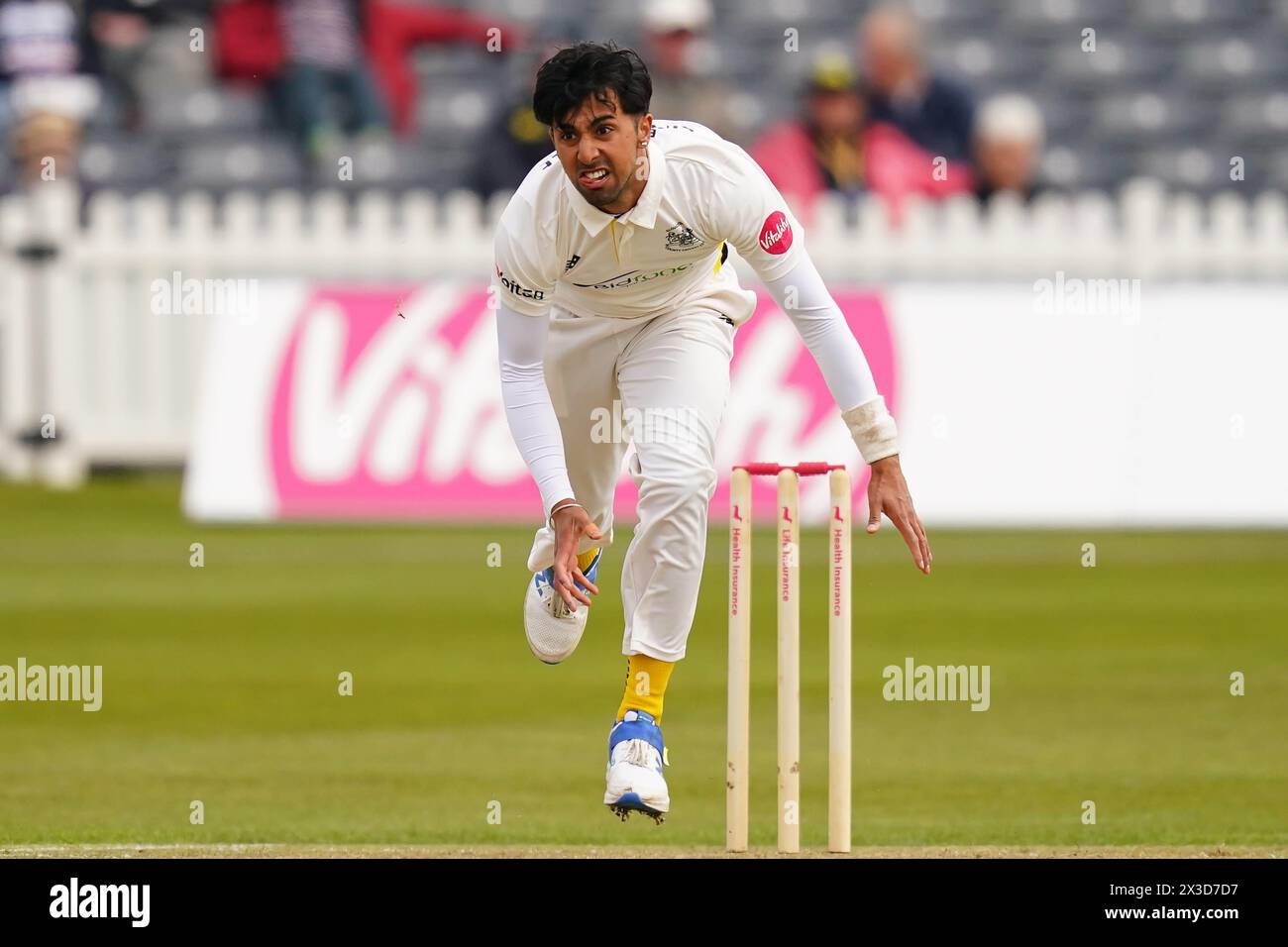 Bristol, UK, 26 April 2024. Gloucestershire's Ajeet Singh Dale bowling during the Vitality County Championship Division Two match between Gloucestershire and Middlesex. Credit: Robbie Stephenson/Gloucestershire Cricket/Alamy Live News Stock Photo