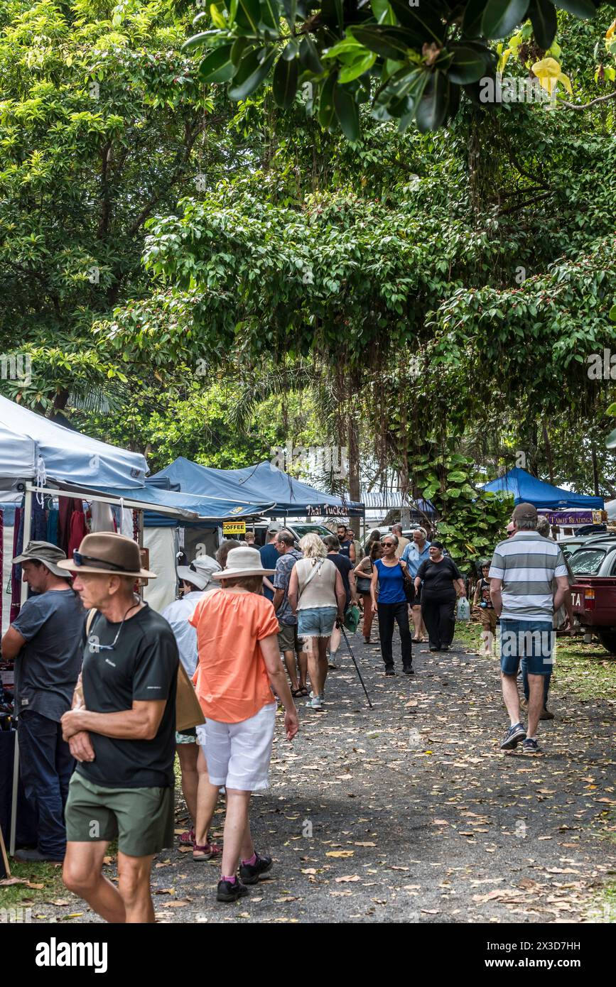 People browsing and shopping at a weekend market in the regional North Queensland town of Mission Beach in Australia Stock Photo