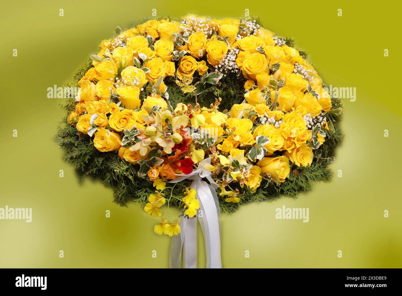 funeral wreath with yellow rose blossoms Stock Photo