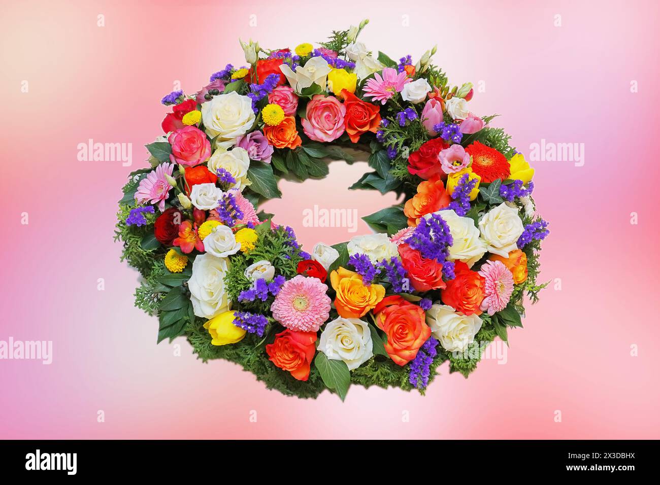 funeral wreath with colored blossoms Stock Photo