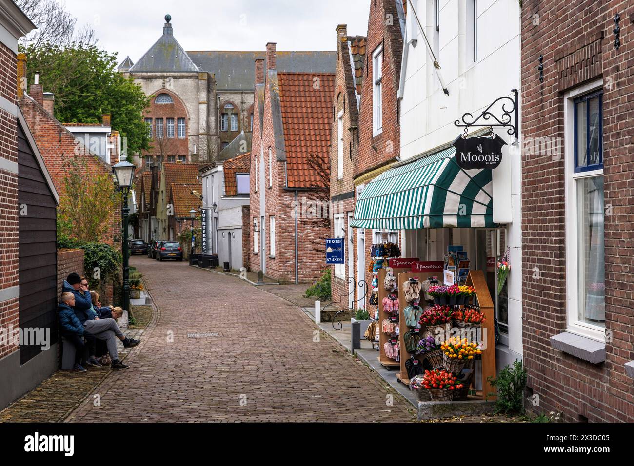 the Kapellestraat in the village Veere on the peninsula Walcheren, in the background the church Grote Kerk, Church of Our Lady, Zeeland, Netherlands. Stock Photo
