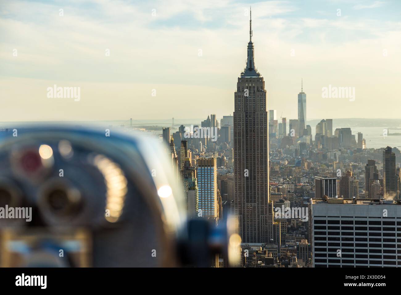 Coin operated telescope and view to Empire State Building & Manhattan, New York, USA Stock Photo