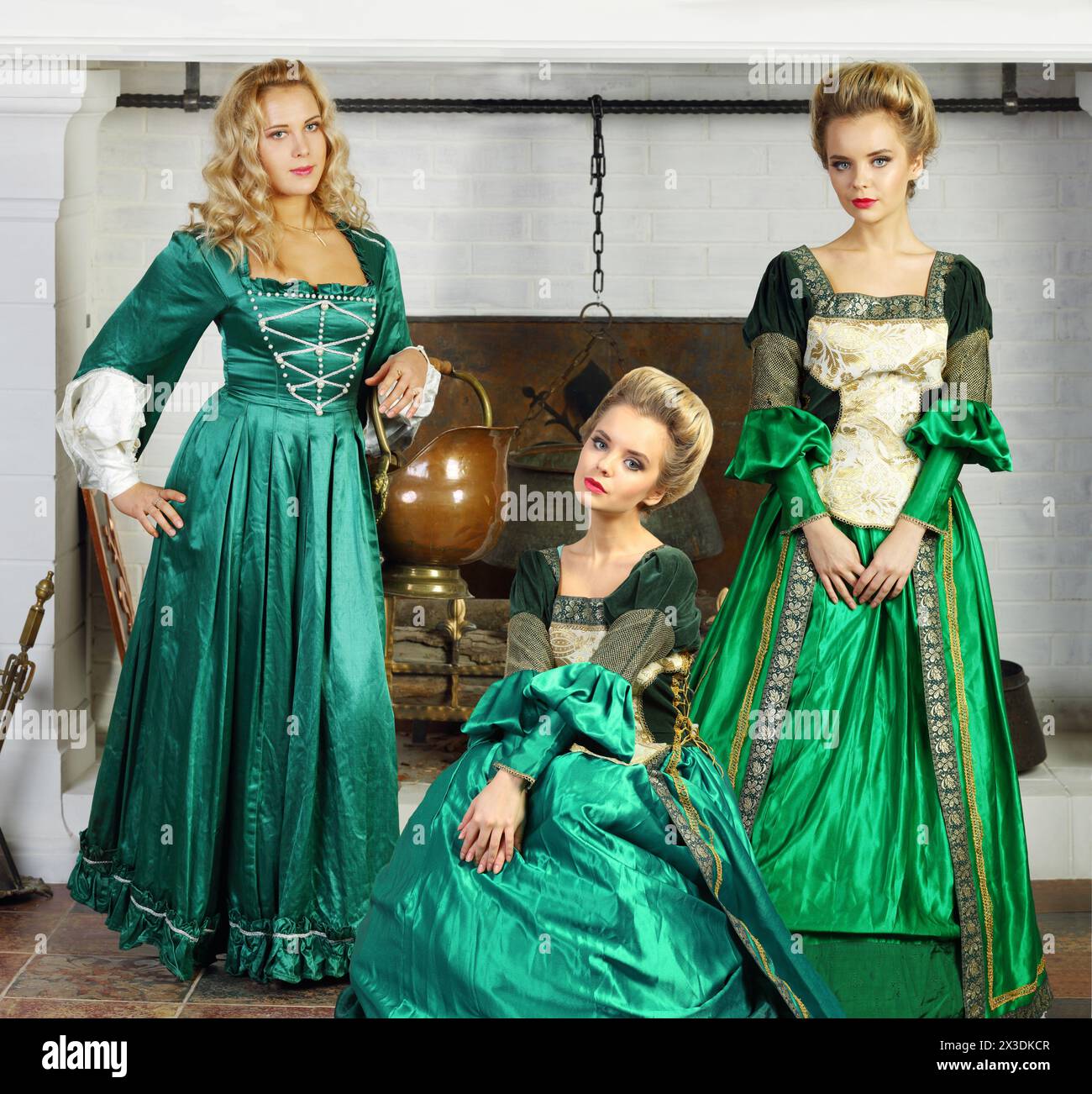 Collage with three beautiful young woman (one model) in green medieval ...