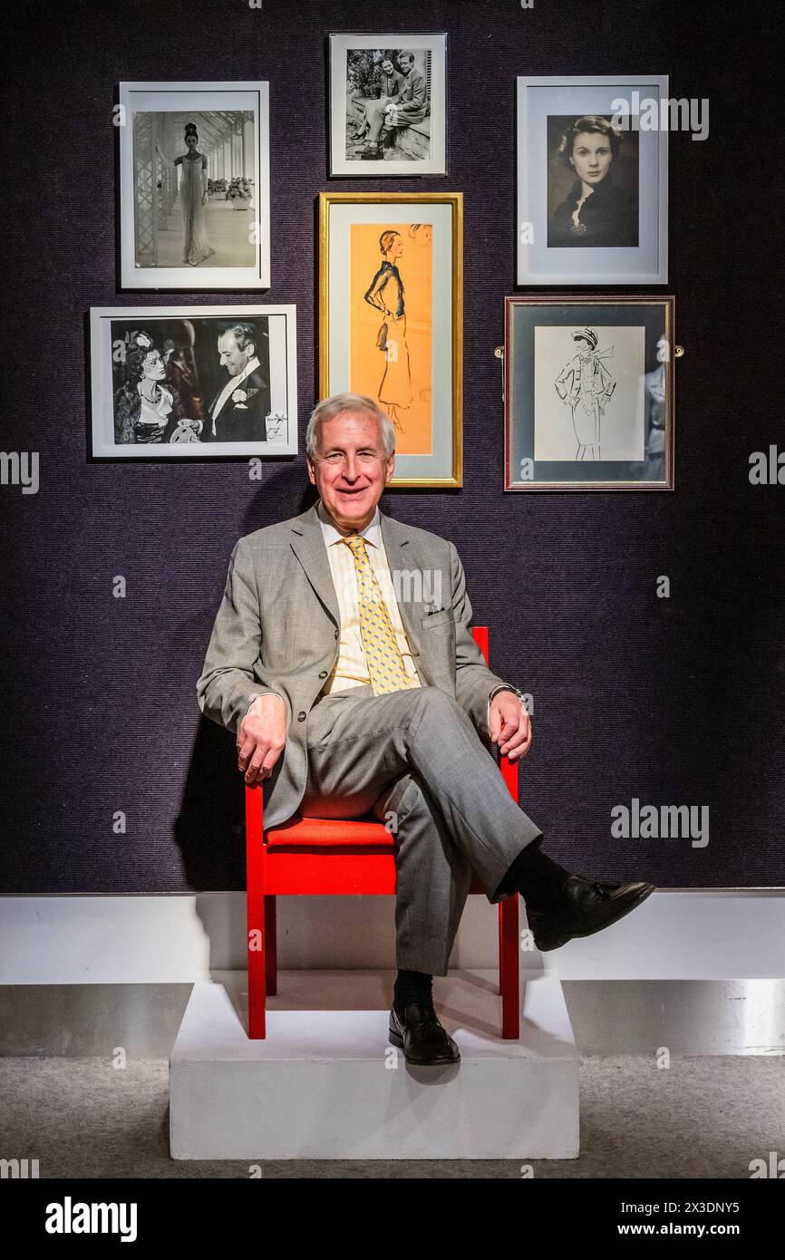 London, UK. 26th Apr, 2024. Royal expert Hugo Vickers with a Prince of Wales Investiture chair, 1969, Designed by Lord Snowdon. Estimate: £1,200 - £1,800 and other items from his collection, which reflects his work and research on the Royal Family. Including Cecil Beaton's A portrait of the Duchess of Windsor Full-length, with additional pencil sketches to the right-hand side, possibly of the Duke of Windsor, Estimate: £10,000 - 15,000 - A preview oft he Collections sale at Bonhams Knightsbridge. Credit: Guy Bell/Alamy Live News Stock Photo