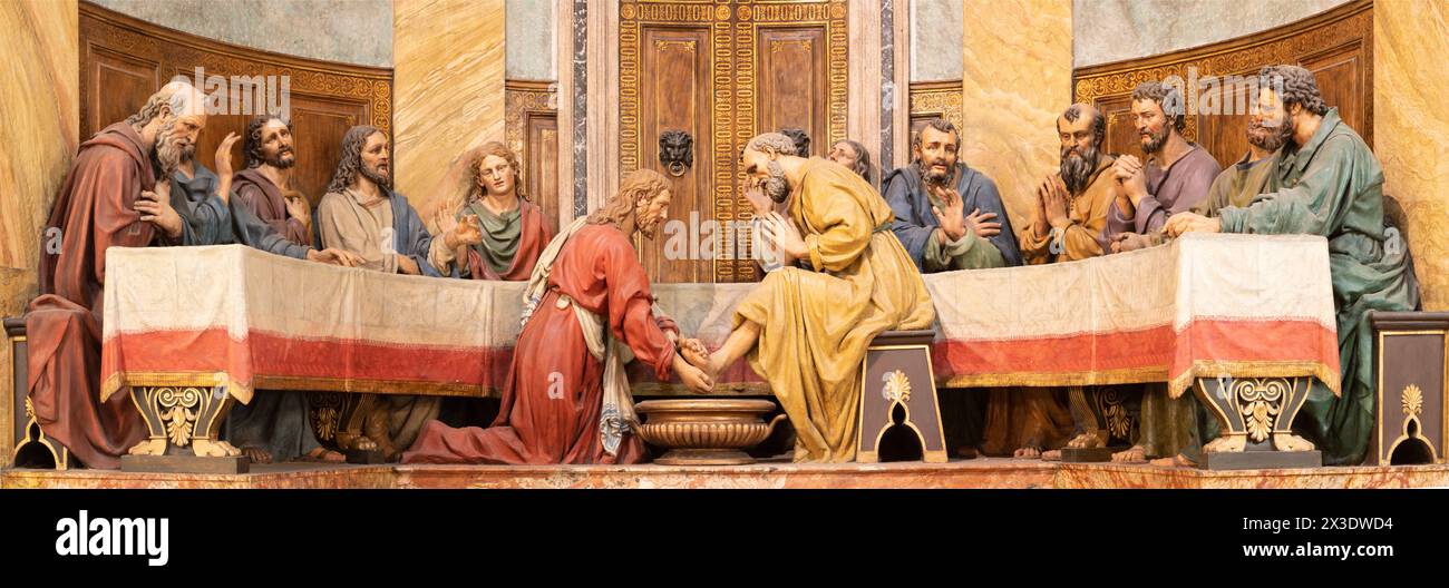 MILAN, ITALY - MARCH 5 2024: The sculptural group of Last Supper (Jesus washed the feet of Peter) in the church Chiesa di San Sepolcro Stock Photo