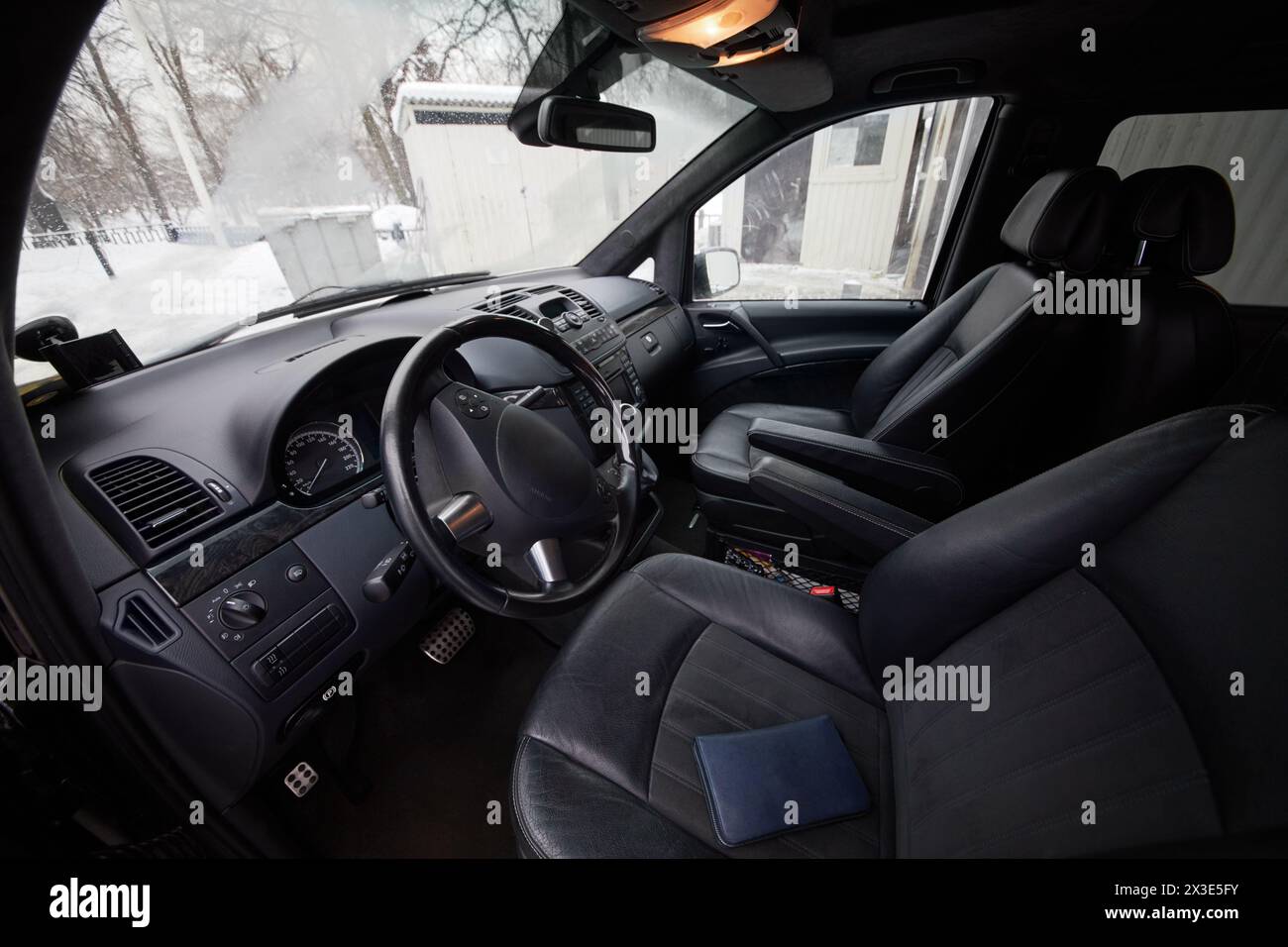 Interior of modern car, driver and passenger seats, dashboard, steering