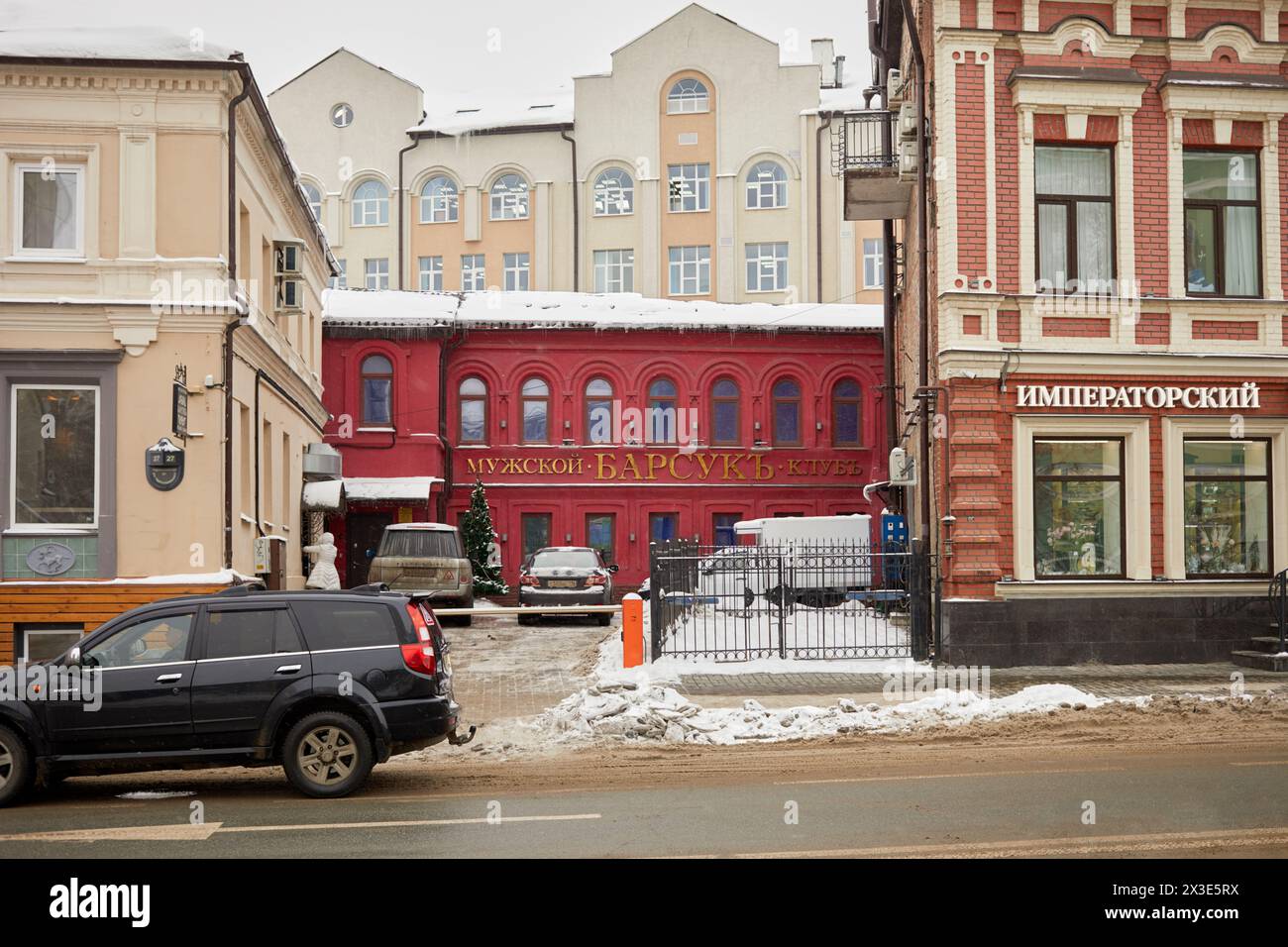 KAZAN, RUSSIA - DEC 8, 2017: Red facade of building of strip club Barsuk at Chernyshevsky street. Stock Photo