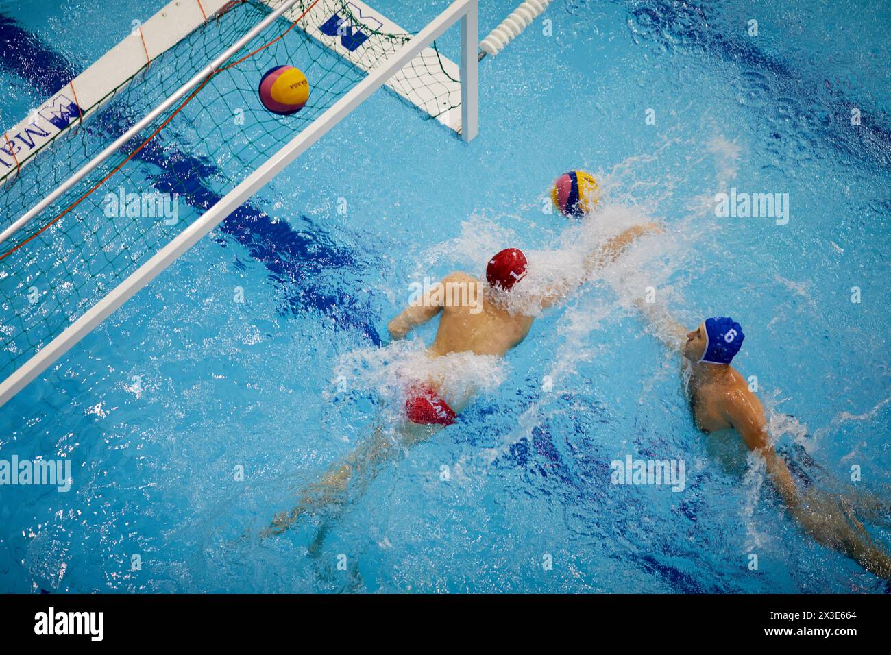 KAZAN, RUSSIA - DEC 09, 2017: Players of teams near goal during friendly match on water polo in Burevestnik basin during All Russia Swimming Competiti Stock Photo
