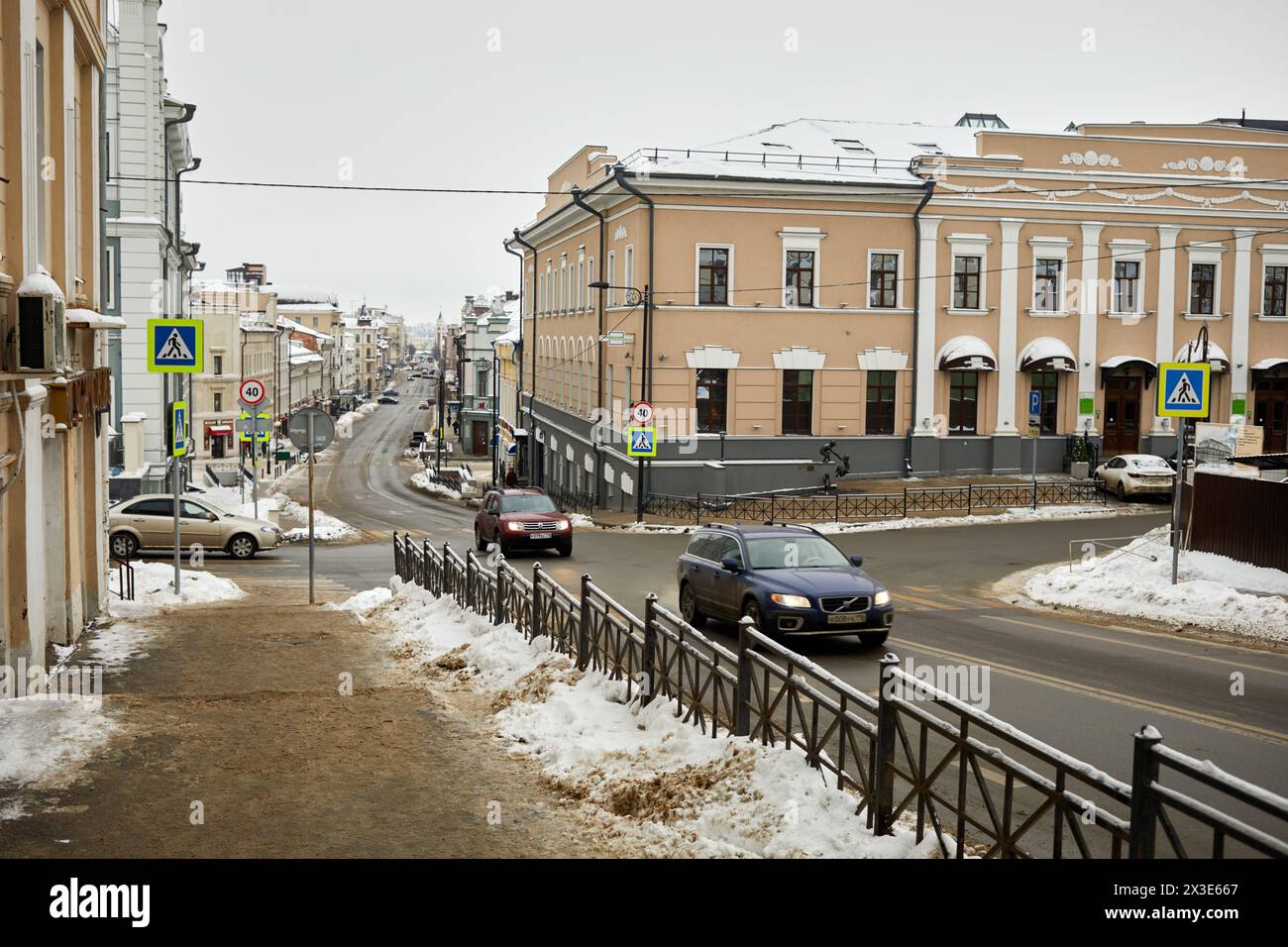 KAZAN, RUSSIA - DEC 10, 2017: Car traffic at Chernyshevsky street on winter day. Street named after N.Chernyshevsky - russian philosopher, democrat, s Stock Photo