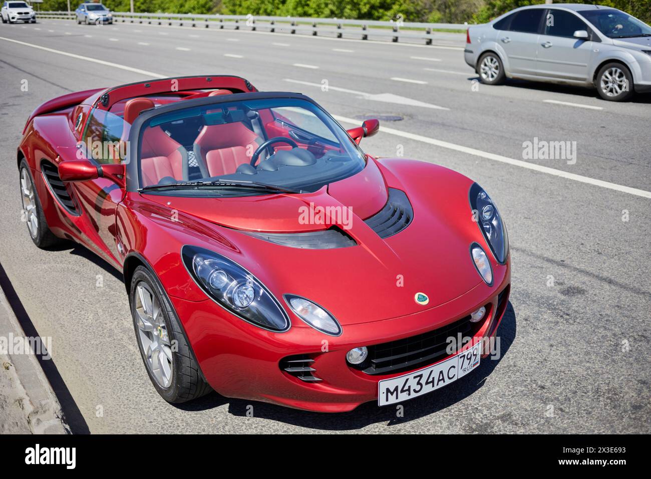 MOSCOW, RUSSIA - MAY 27, 2018: Red Lotus car stands on multilane highway. Stock Photo