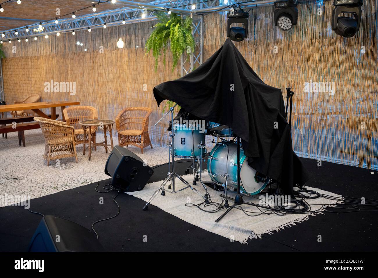 A drum kit is covered the morning after a local band played to visitors at a rum festival on Avenida Arriaga, on 18th April 2024, in Funchal, Madeira, Portugal. Stock Photo