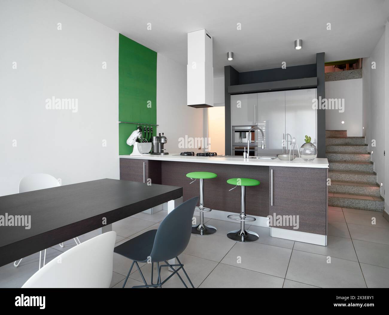 Interior view of a modern kitchen in the foregorund Stock Photo
