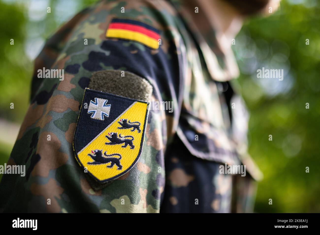 Karlsruhe, Germany. 26th Apr, 2024. A Bundeswehr soldier has a patch of ...