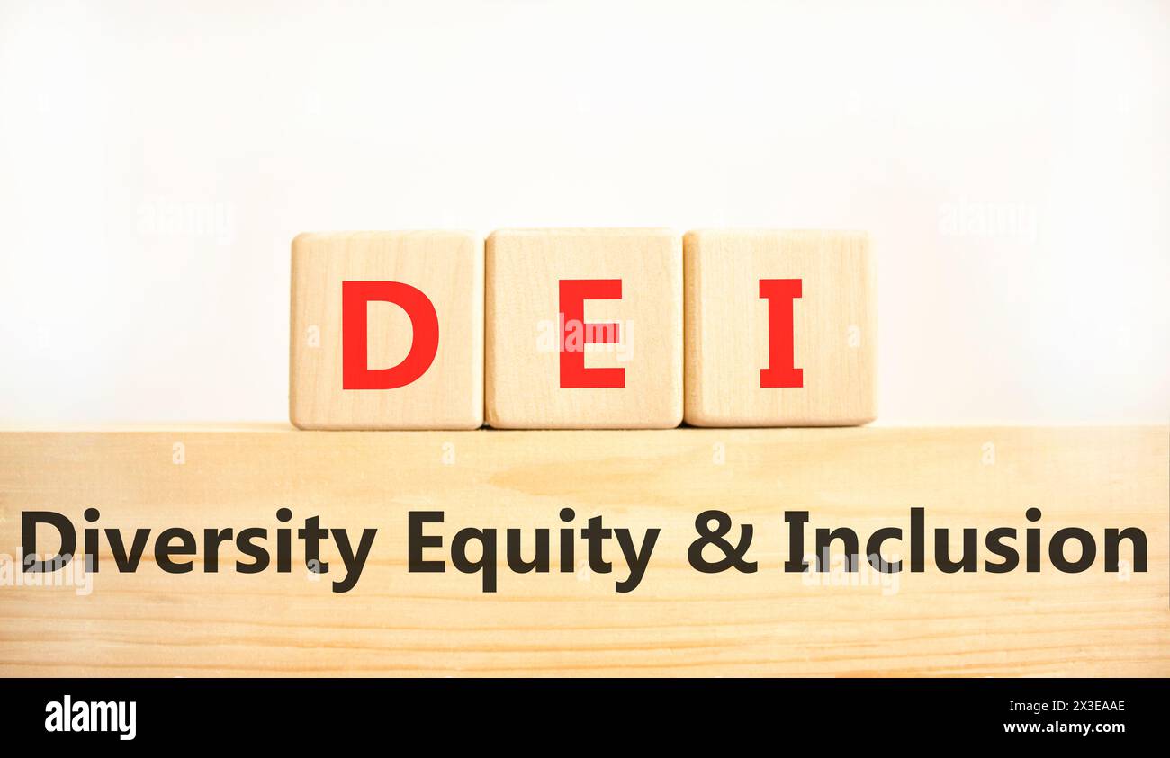 DEI diversity equity and inclusion symbol. Concept words DEI diversity equity and inclusion on blocks. Beautiful white background. Business DEI divers Stock Photo