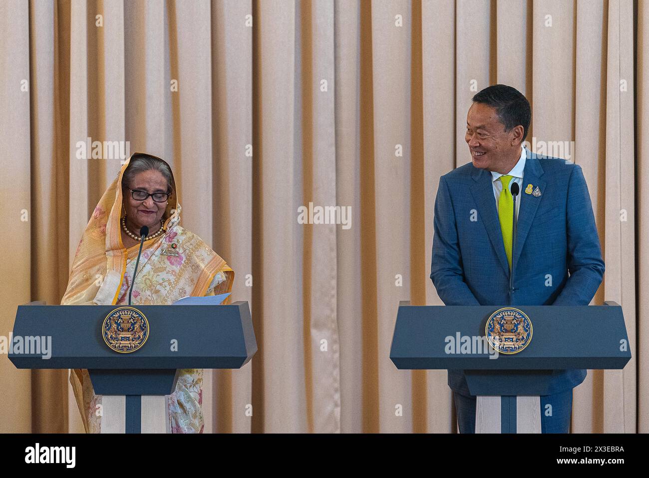 Bangkok, Thailand. 26th Apr, 2024. Bangladesh's prime minister Sheikh Hasina (L) and Thailand's Prime Minister Srettha Thavisin (R) speak to the media during a press conference at Government House. Bangladesh's prime minister Sheikh Hasina is on a six-day official visit to Thailand that aim to strengthen ties between the two nations. Sheikh Hasina is the first prime minister of Bangladesh who official visit Thailand since 2002. (Photo by Peerapon Boonyakiat/SOPA Images/Sipa USA) Credit: Sipa USA/Alamy Live News Stock Photo
