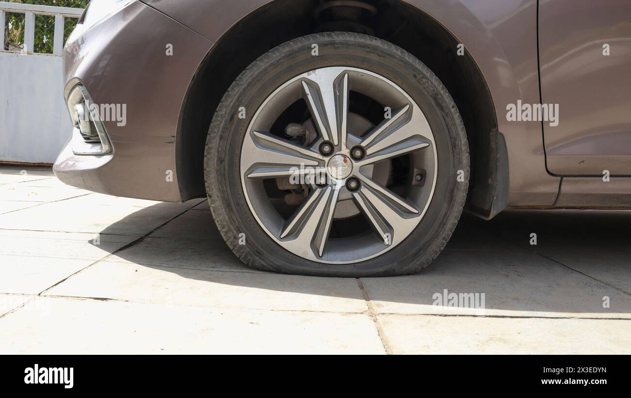 Flat tyre car, Flat car tire wheel punctured Stock Photo