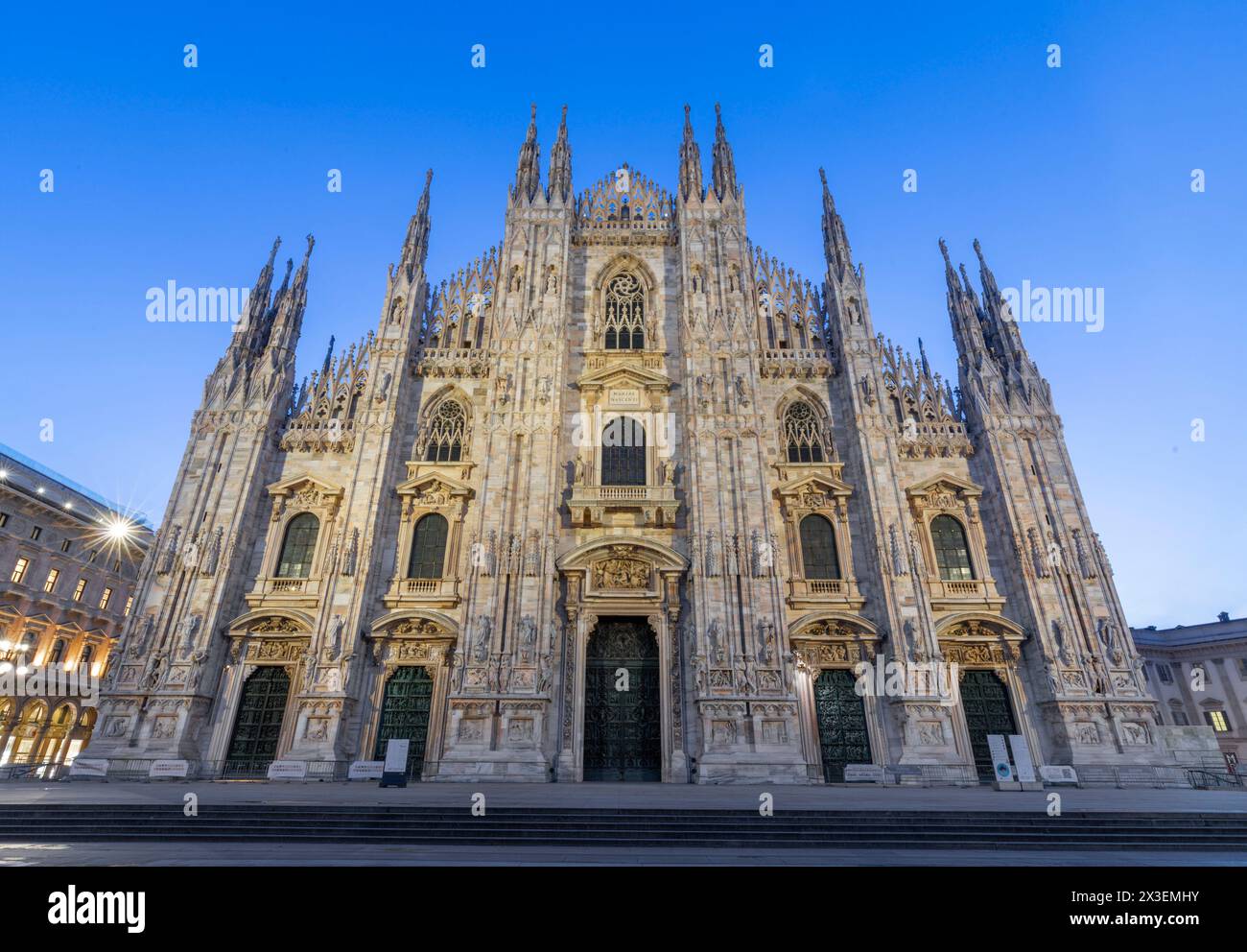 MILAN, ITALY - MARCH 4, 2024:  The westfacade of Duomo - cathedral at dusk Stock Photo