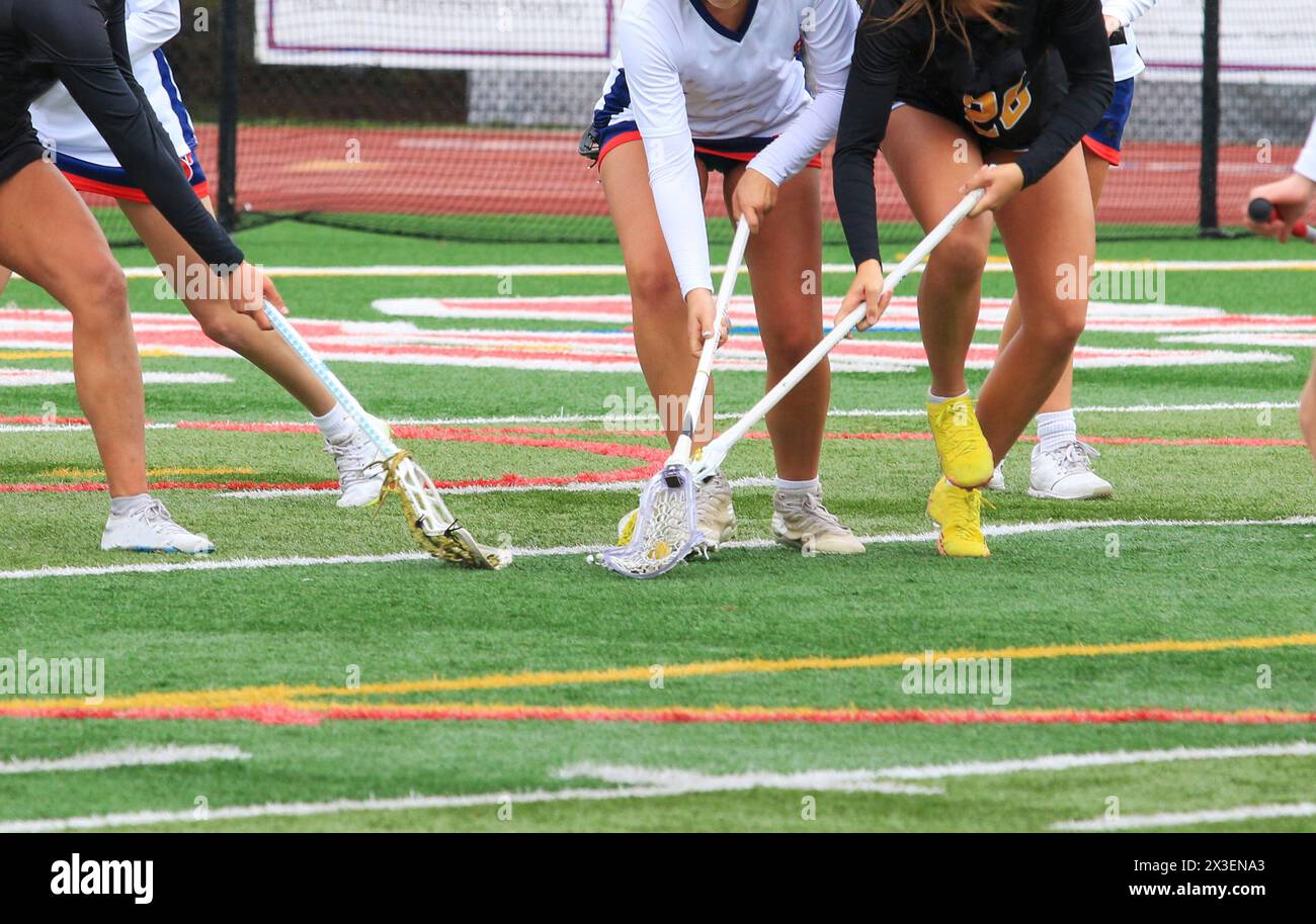 Three high school girls fighting for the ball during a game. Stock Photo