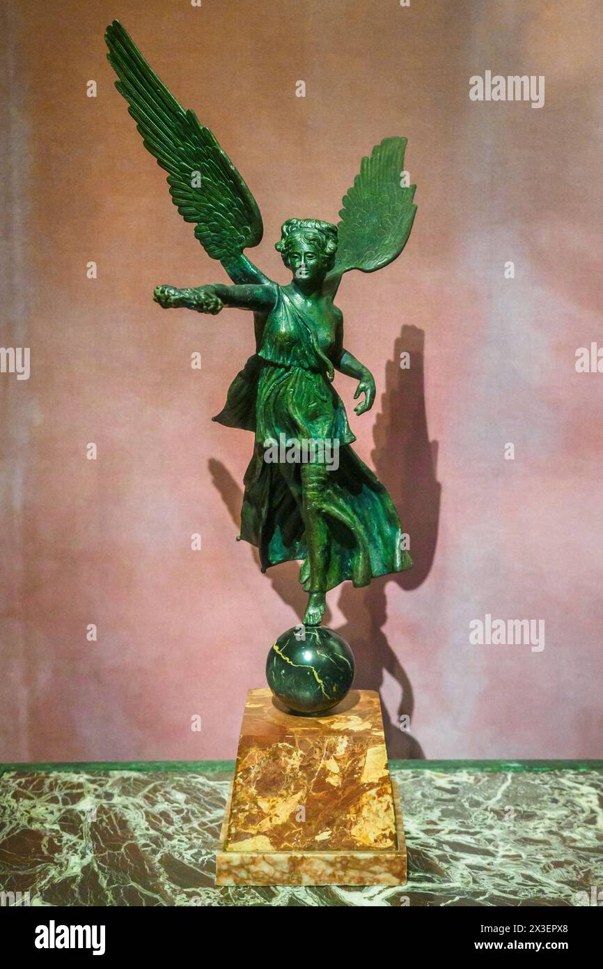 Statuette of winged Victory on globe from Fonderia ignota, replica of an ancient original by MAN, late 10th century, bronze, red marble base, Portoro globe Stock Photo