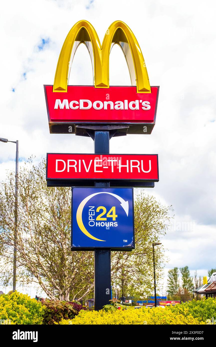 Sign for McDonald's drive thru fast food outlet, and open 24 hours, Ayr, Ayrshire, Scotland, UK Stock Photo