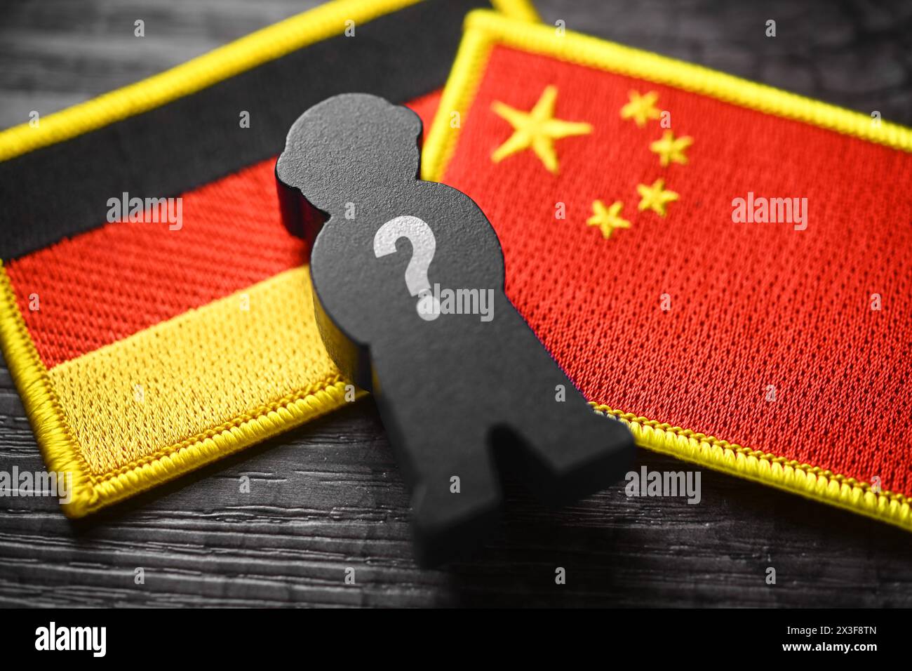 Black Figure With Question Mark On The Flags Of Germany And China