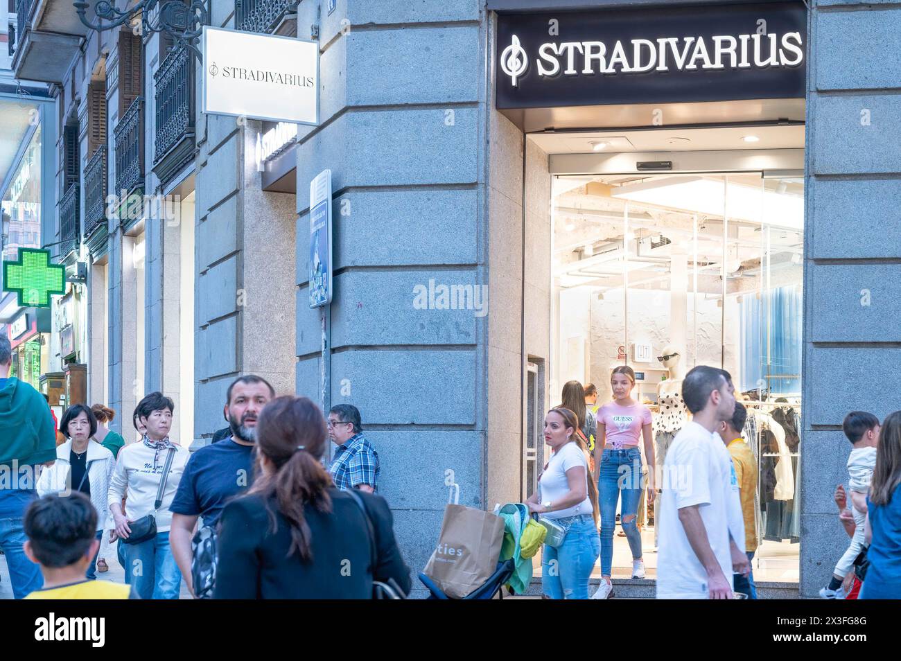 Shoppers and pedestrians are seen in front of the Spanish women's