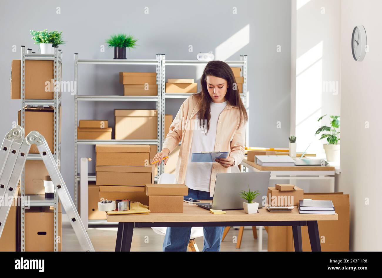 Female worker packing box in warehouse hi-res stock photography and ...