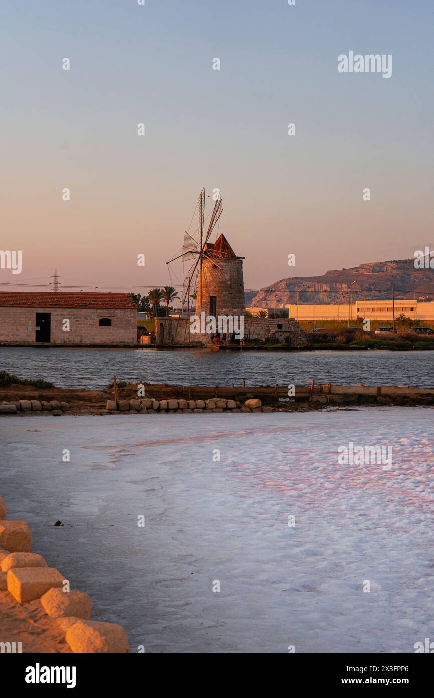 Old windmill in Saline di Trapani e Paceco on sunset, Sicily. Stock Photo