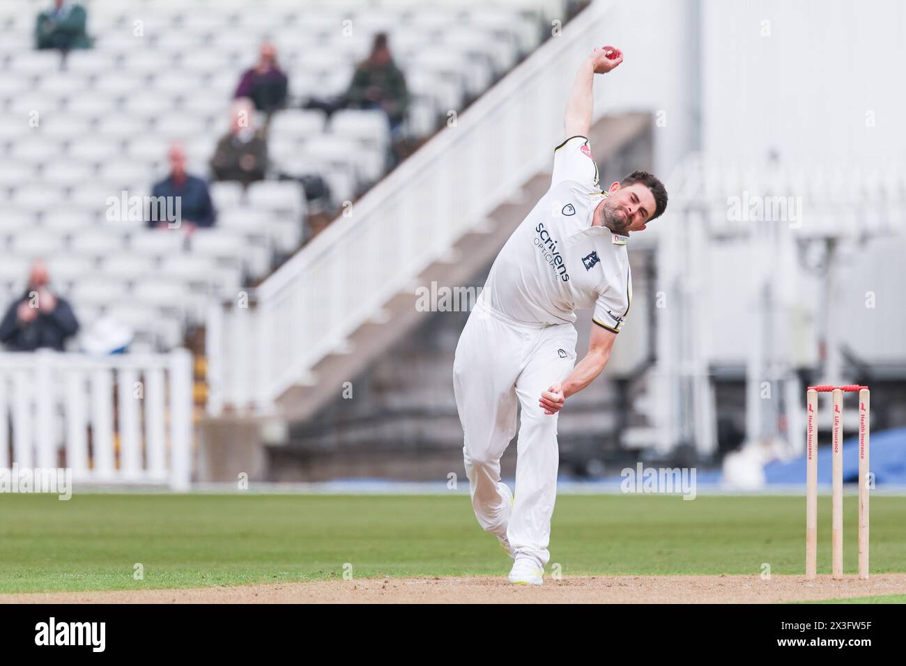 Pictured is Will Rhodes of Warwickshire in action bowling taken in ...