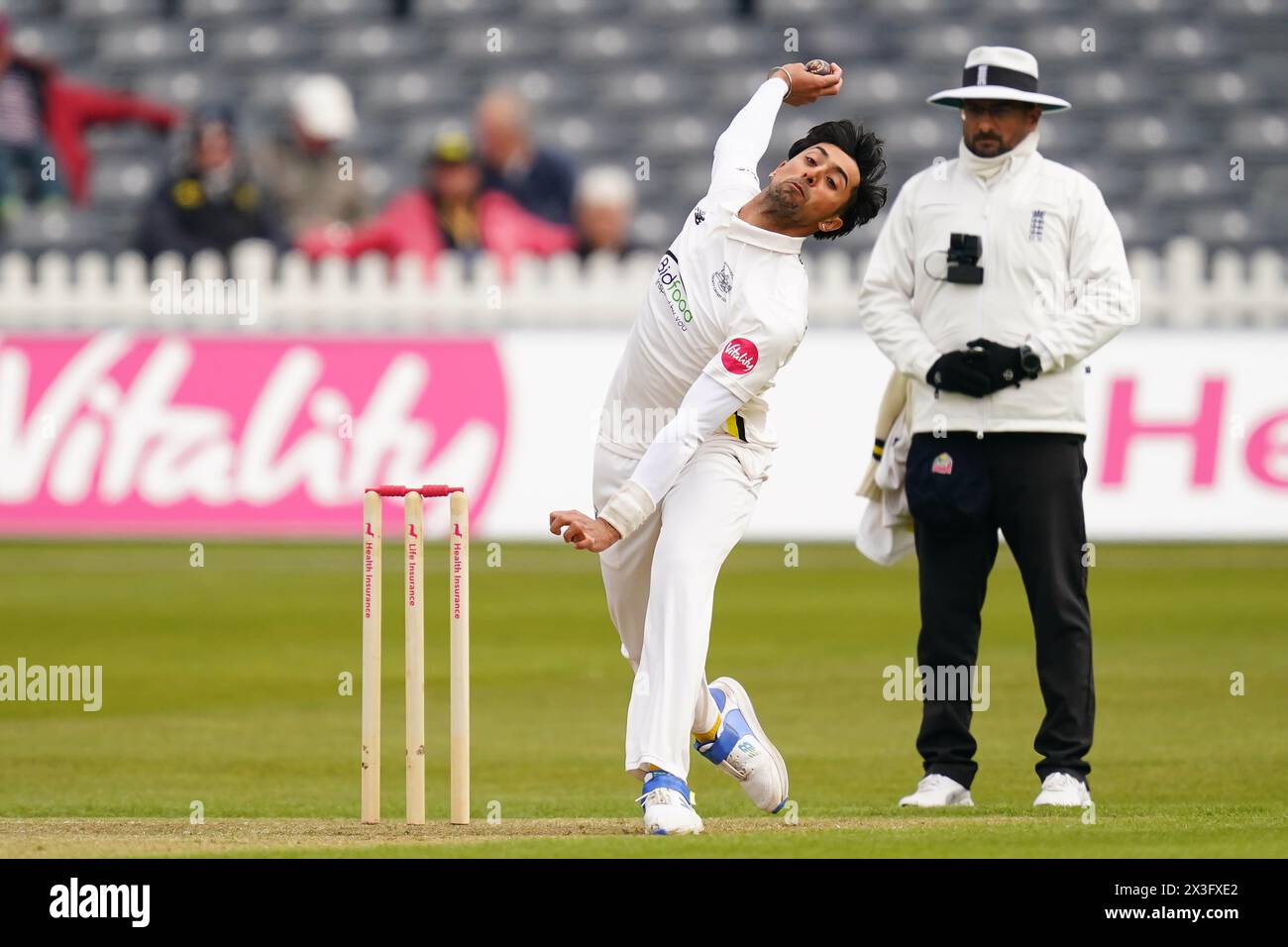 Bristol, UK, 26 April 2024. Gloucestershire's Ajeet Singh Dale bowling during the Vitality County Championship Division Two match between Gloucestershire and Middlesex. Credit: Robbie Stephenson/Gloucestershire Cricket/Alamy Live News Stock Photo