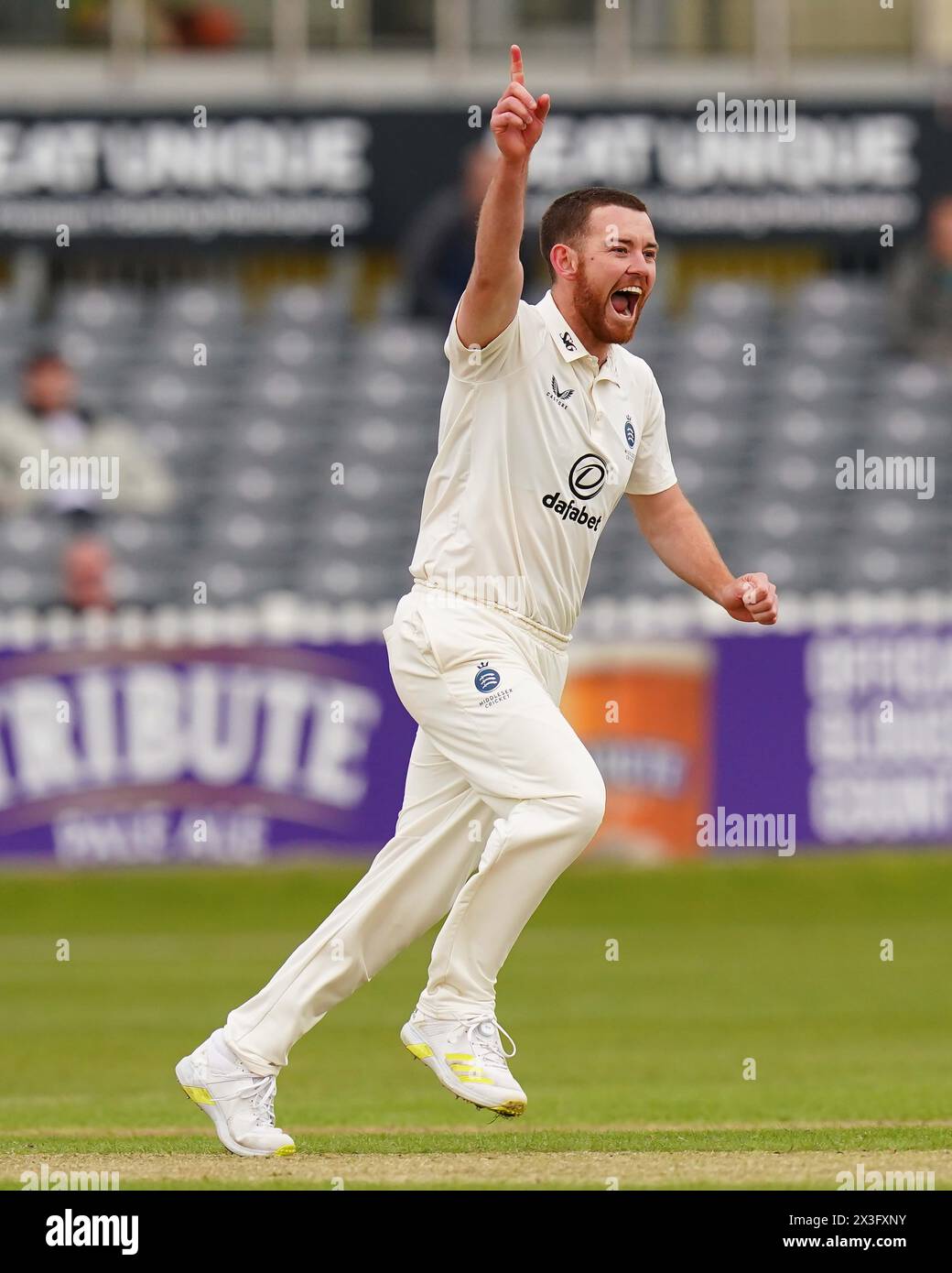 Bristol, UK, 26 April 2024. Middlesex's Ryan Higgins celebrates taking the wicket of Gloucestershire's Cameron Bancroft during the Vitality County Championship Division Two match between Gloucestershire and Middlesex. Credit: Robbie Stephenson/Gloucestershire Cricket/Alamy Live News Stock Photo