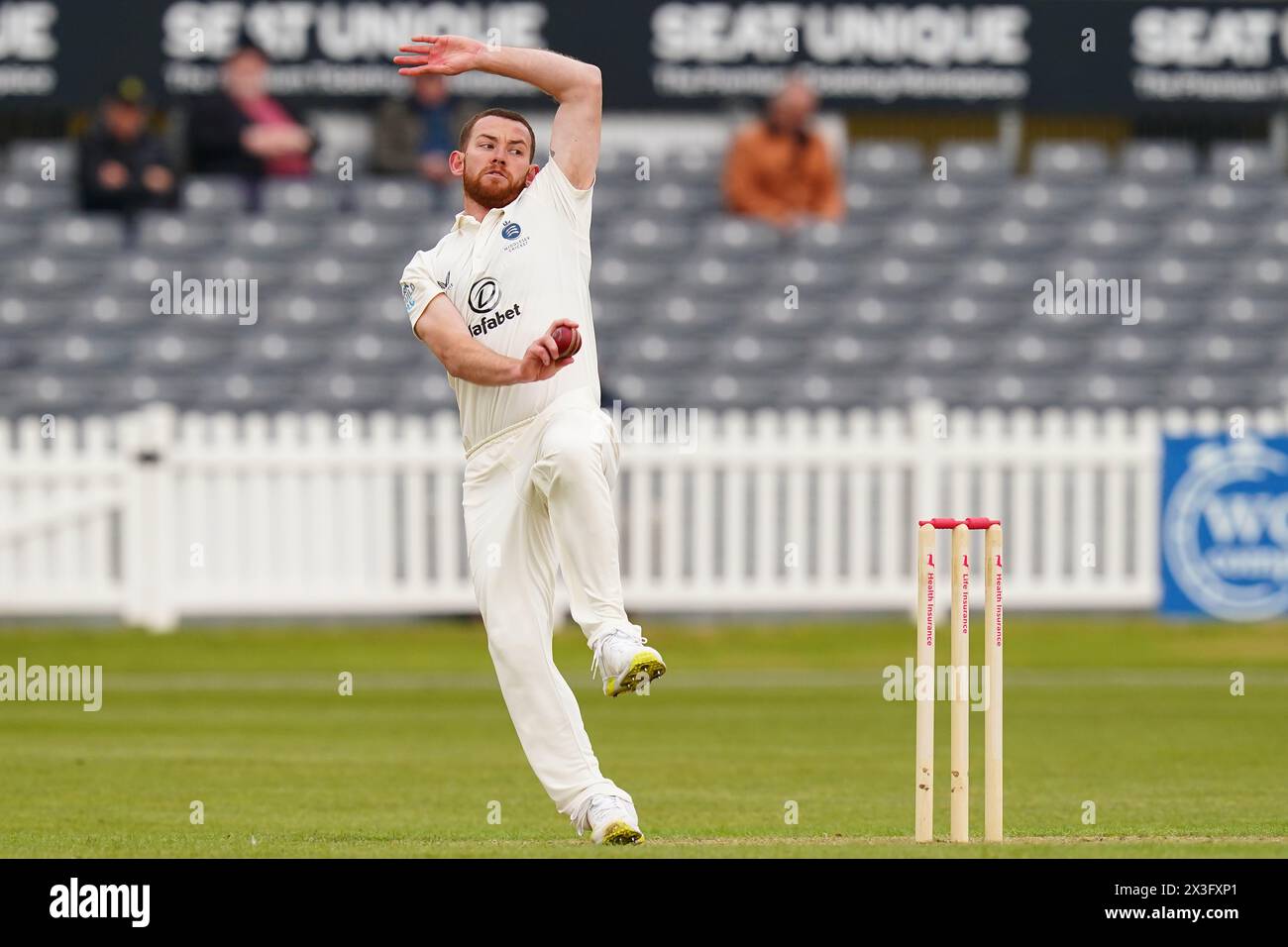 Bristol, UK, 26 April 2024. Middlesex's Ryan Higgins bowling during the Vitality County Championship Division Two match between Gloucestershire and Middlesex. Credit: Robbie Stephenson/Gloucestershire Cricket/Alamy Live News Stock Photo