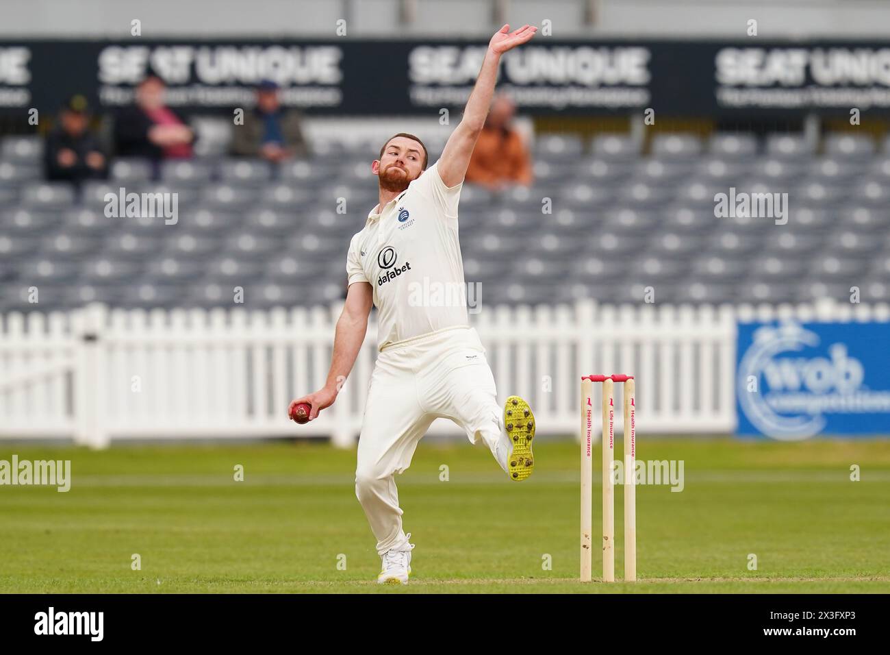 Bristol, UK, 26 April 2024. Middlesex's Ryan Higgins bowling during the Vitality County Championship Division Two match between Gloucestershire and Middlesex. Credit: Robbie Stephenson/Gloucestershire Cricket/Alamy Live News Stock Photo