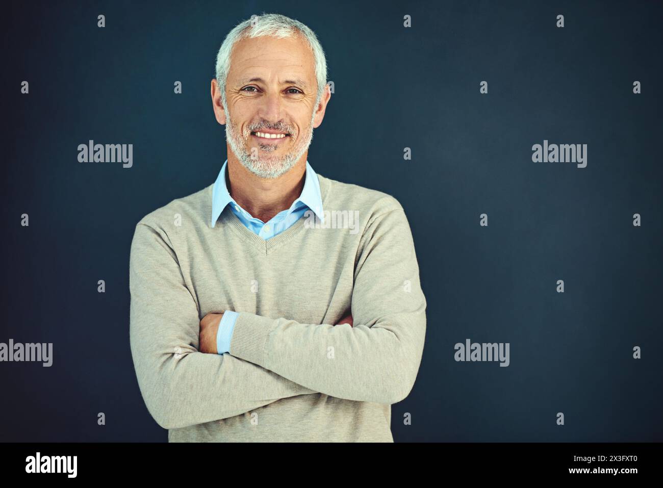 Mature, man and portrait of happy professor in studio, blue background ...