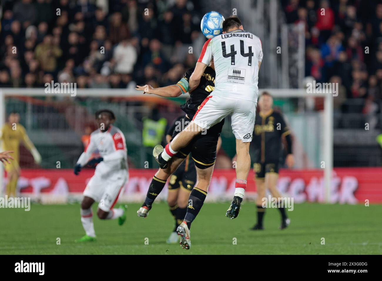 Venice, Italy. 26th Apr, 2024. Luka Lochoshvili (Cremonese) in action against Joel Pohjanpalo (Venezia) during Venezia FC vs US Cremonese, Italian soccer Serie B match in Venice, Italy, April 26 2024 Credit: Independent Photo Agency/Alamy Live News Stock Photo