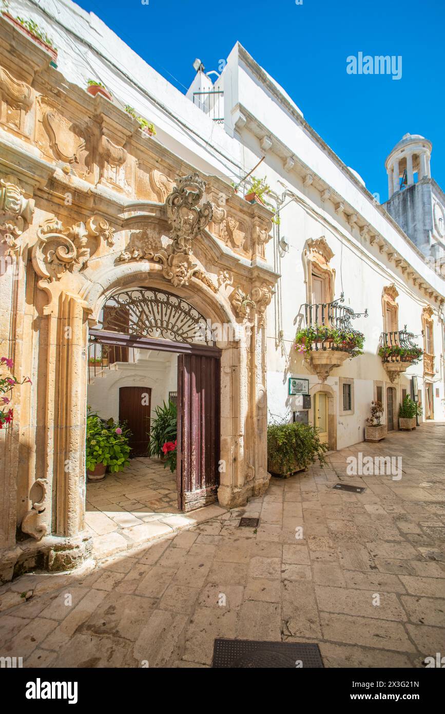View of narrow historical street of Locorotondo, near Bari. Stock Photo