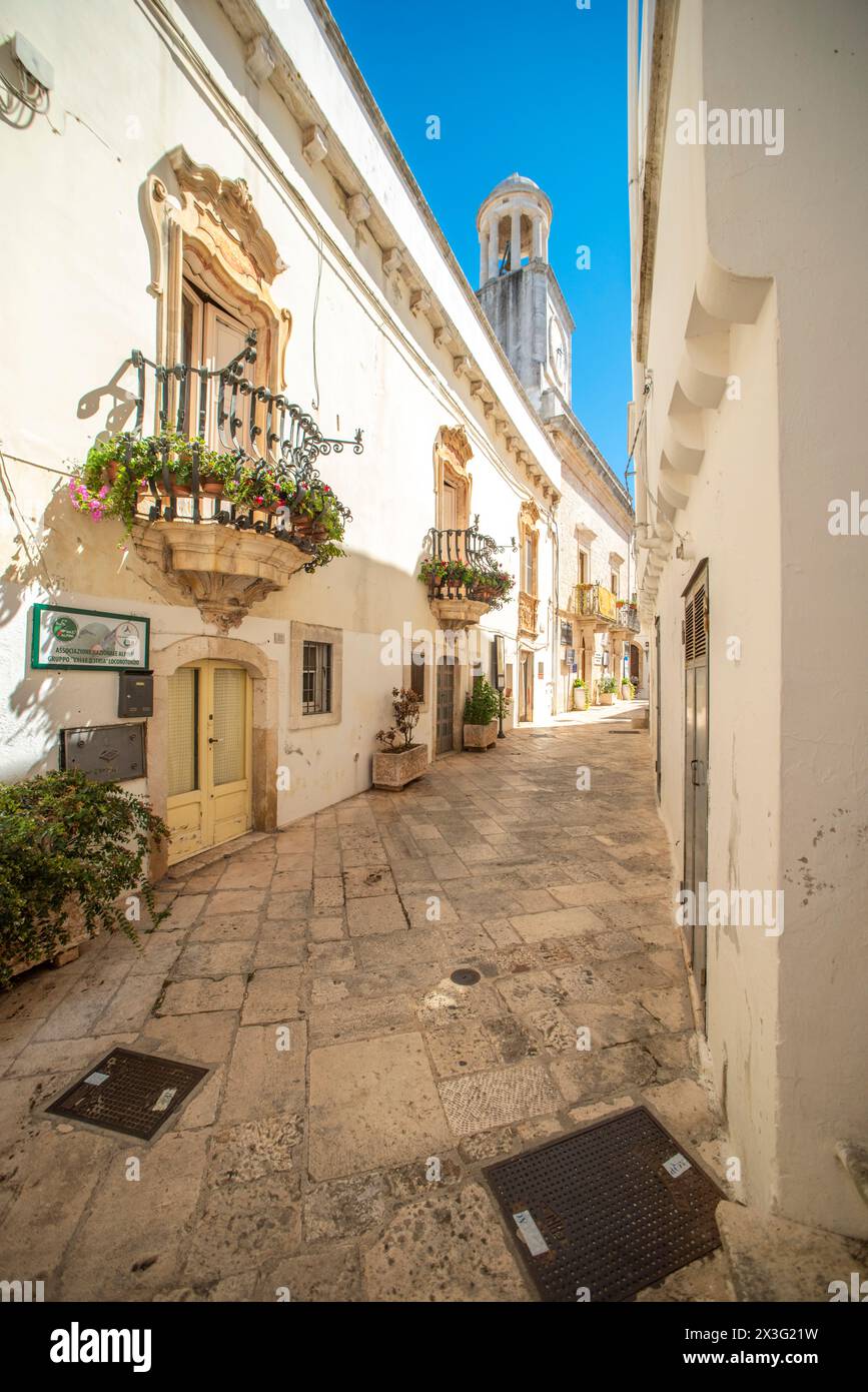 View of narrow historical street of Locorotondo, near Bari. Stock Photo