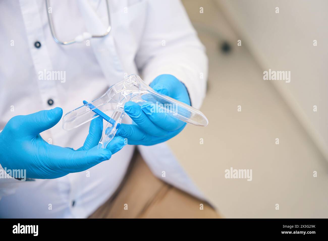 Professional nurse holding medical instrument in hospital Stock Photo ...
