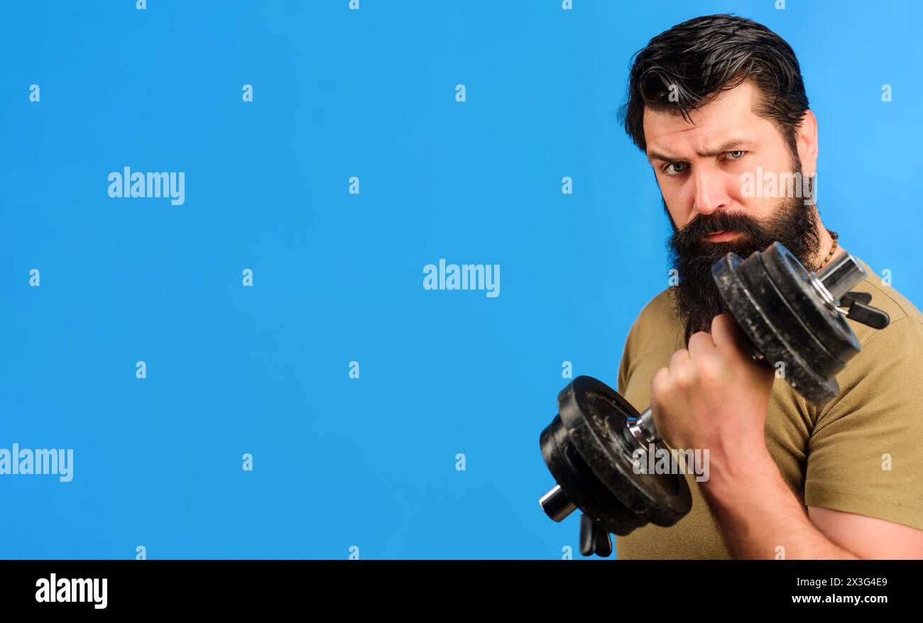 Weightlifting and bodybuilding. Strong bearded muscular sportsman