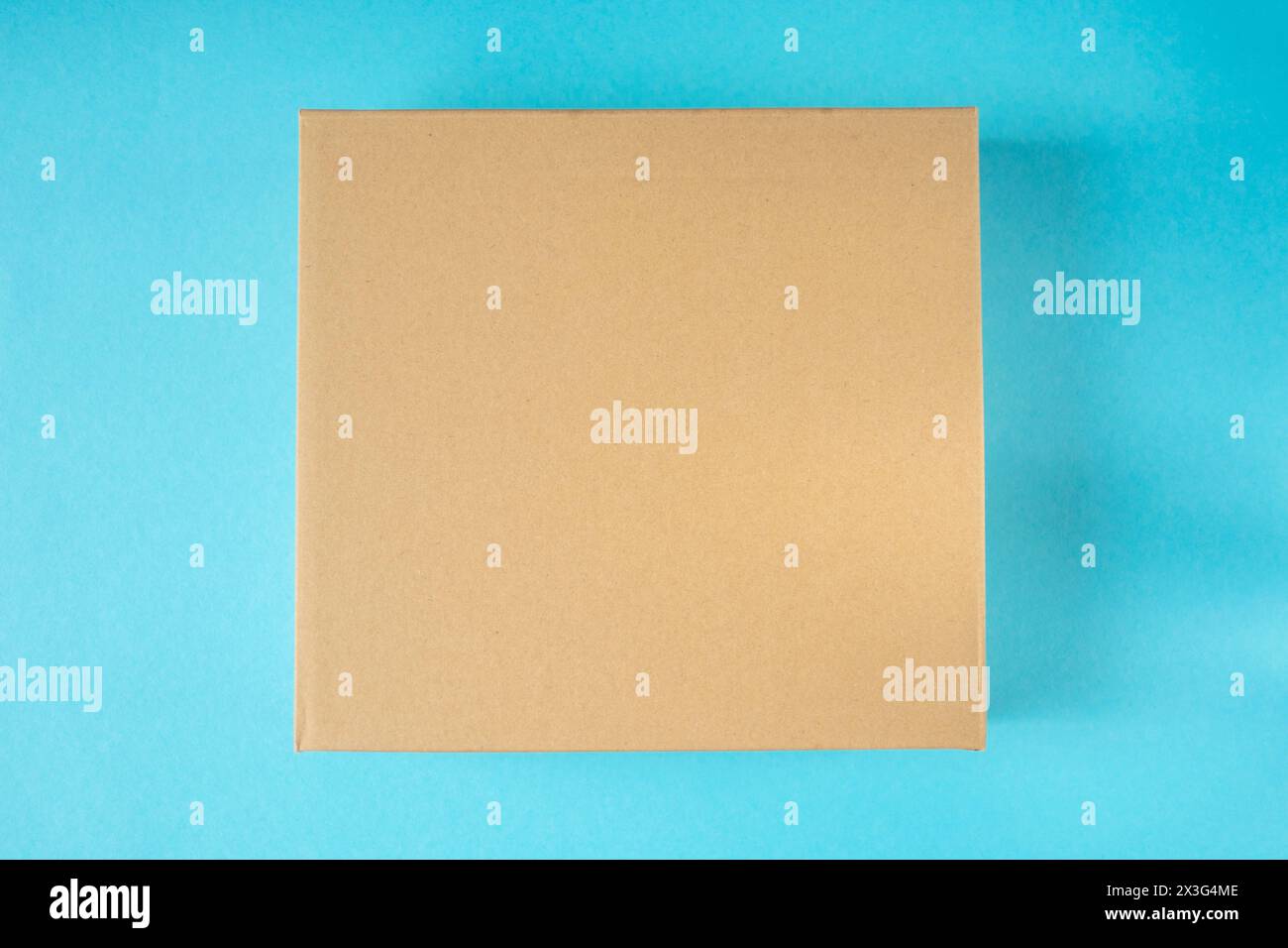 Little cardboard box on blue background. Mockup for design Stock Photo ...