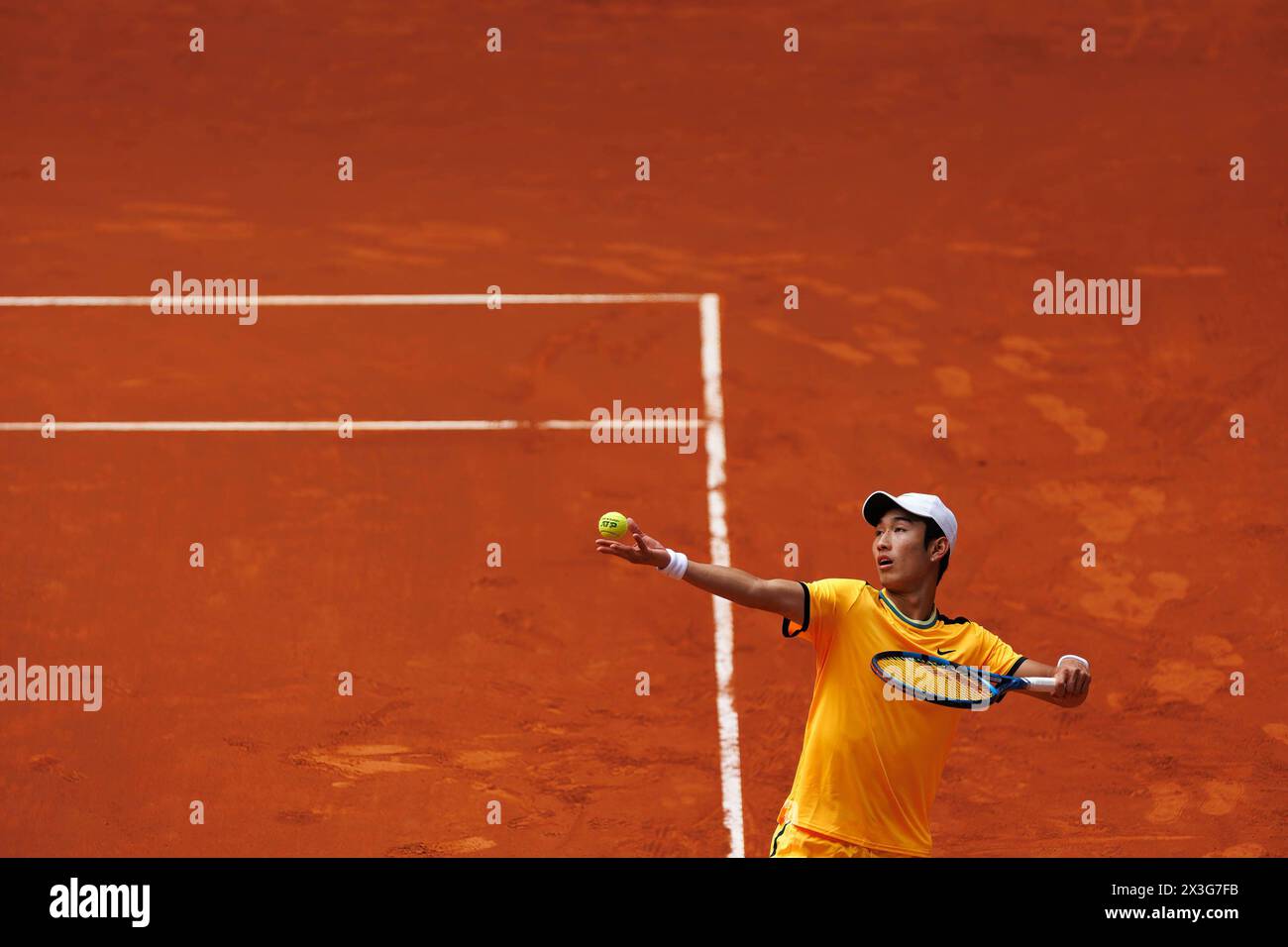 Madrid, Spain. 26th Apr, 2024. Juncheng Shang plays against Alejandro Davidovich (not pictured) during their match on Day 5 of the Mutua Madrid Open at Caja Magica Stadium. Alejandro Davidovich won 7 -5, 6-3 Credit: SOPA Images Limited/Alamy Live News Stock Photo