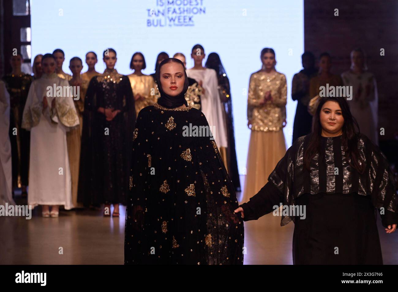 Istanbul, Istanbul, Turkey. 25th Apr, 2024. Models seen with the designer Sheena Hussain.The Istanbul Modest Fashion Week 2024 started on 25 April 2024 in Fisekhane Gallery. Organized by Think Fashion, the first day saw 12 Turkish and international brands on the runaways. (Credit Image: © Valeria Ferraro/ZUMA Press Wire) EDITORIAL USAGE ONLY! Not for Commercial USAGE! Stock Photo