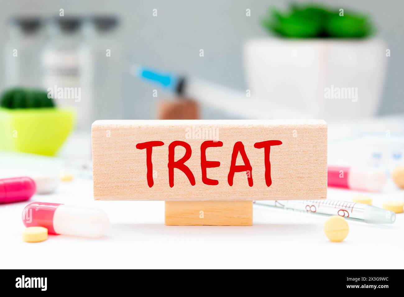 TREAT word on notebook with medical equipment on a background. Stock Photo