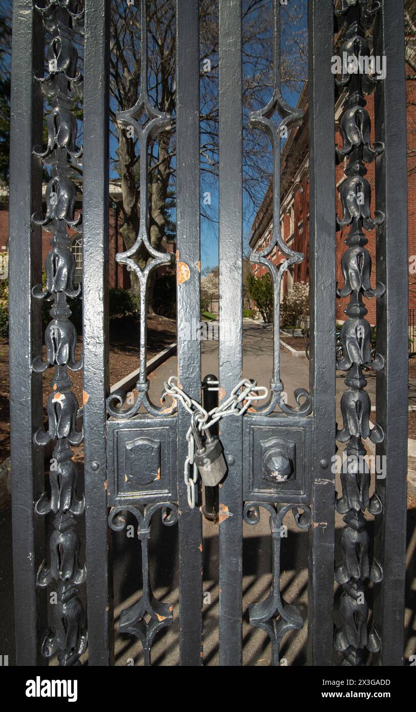 Harvard Yard Closed.  Harvard University has restricted access to Harvard Yard at the center of the University campus in Cambridge, MA, USA.  Entrances have been closed to Non-Harvard-ID holders in anticipation of pro-Palestine student demonstrations. A chained and locked small entrance to the central Harvard campus on Quincy Street Credit: Chuck Nacke / Alamy Live News Stock Photo