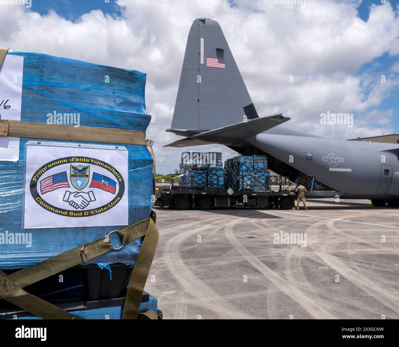 Homestead, United States. 26th Apr, 2024. U.S. Air Force loadmasters secure pallets of humanitarian aid and medical supplies for Haiti before loading into the cargo bay of a Air Force C-130J Super Hercules aircraft at Homestead Air Reserve Base, April 26, 2024, in Homestead, Florida. The emergency supplies provided by NGO's were delivered to Port-au-Prince. Credit: TSgt. Lionel Castellano/US Airforce Photo/Alamy Live News Stock Photo