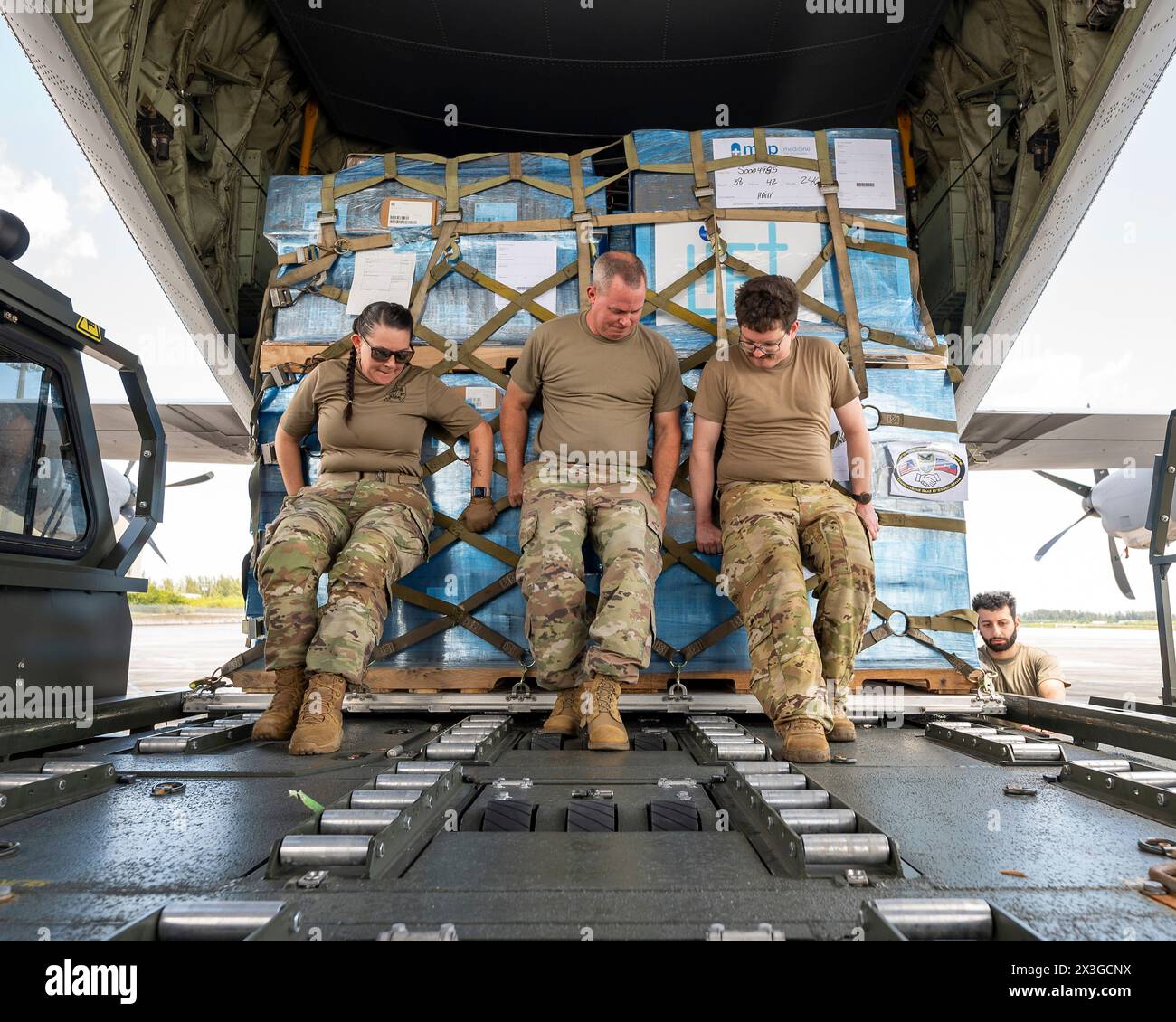 Homestead, United States. 26th Apr, 2024. U.S. Air Force loadmasters secure pallets of humanitarian aid and medical supplies for Haiti into the cargo bay of a Air Force C-130J Super Hercules aircraft at Homestead Air Reserve Base, April 26, 2024, in Homestead, Florida. The emergency supplies provided by NGO's were delivered to Port-au-Prince. Credit: TSgt. Lionel Castellano/US Airforce Photo/Alamy Live News Stock Photo