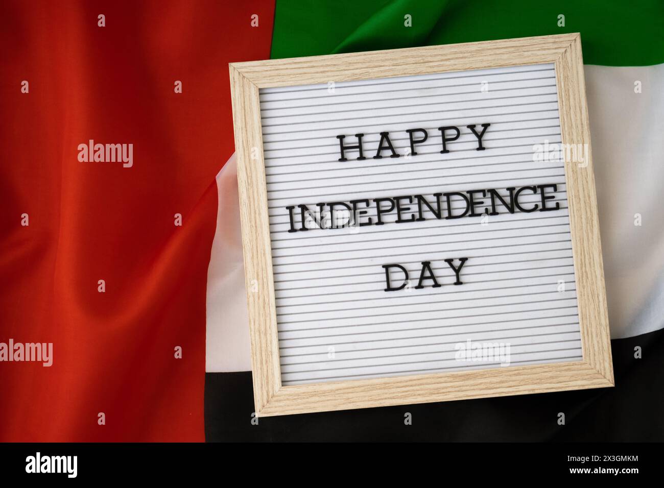 HAPPY INDEPENDENCE DAY text frame on United Arab Emirates waving flag ...